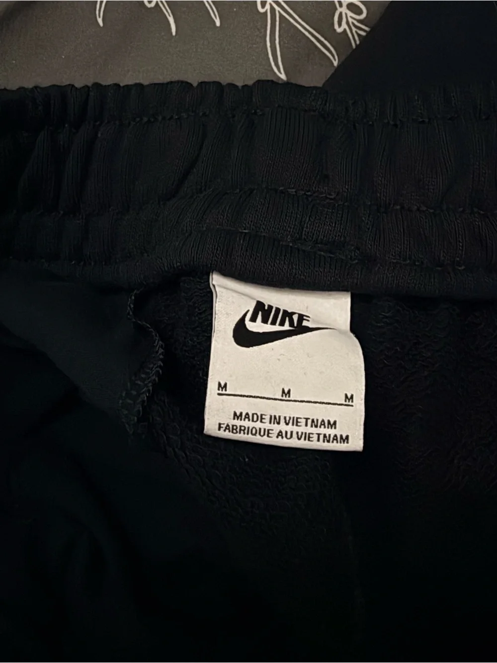 Nike Black Zip-Up Sweatpants with White Logo